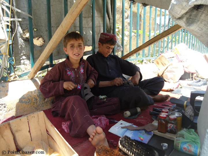 Brothers repairing shoes in the Golden City area of Kabul