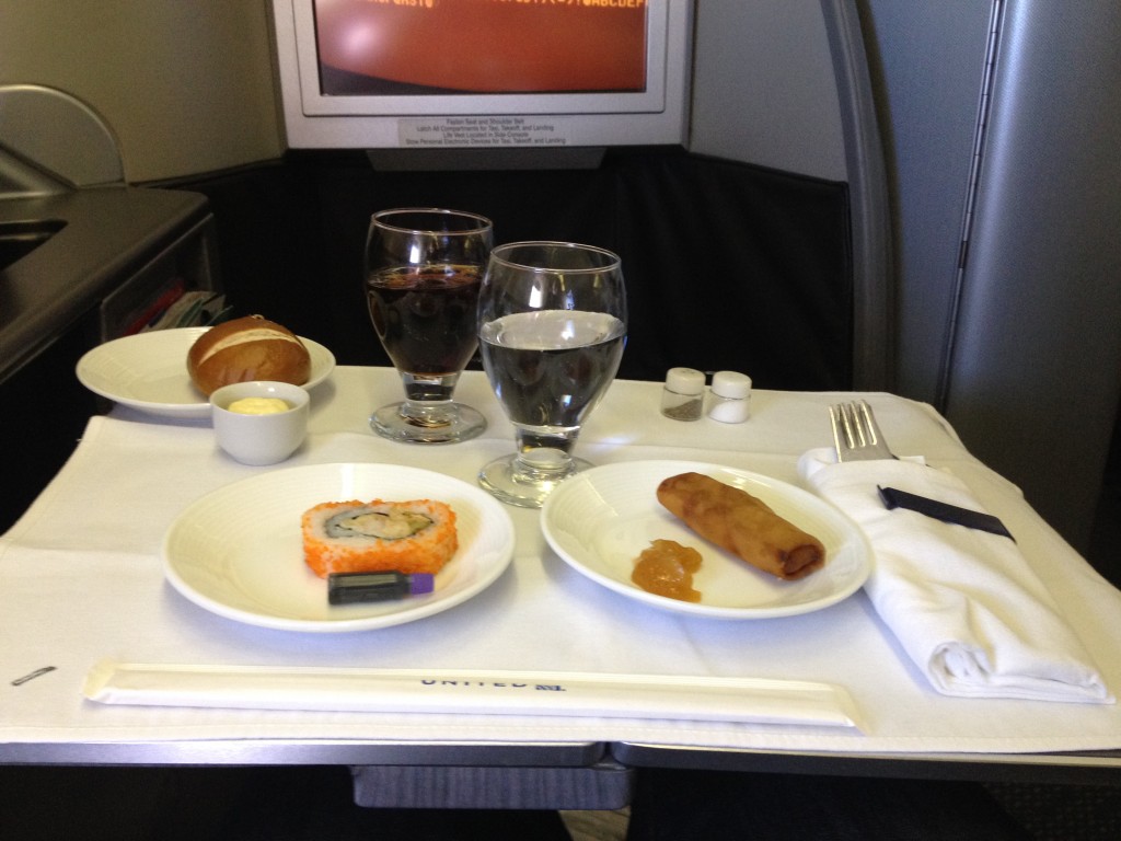 United Airlines Global First Class 747 HNL - NRT Meal Sushi and Spring Roll
