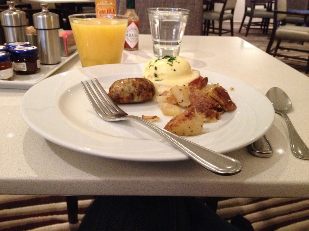 Breakfast at Vines Cafe: Eggs Benedict, Chicken Sausage, and Potatoes