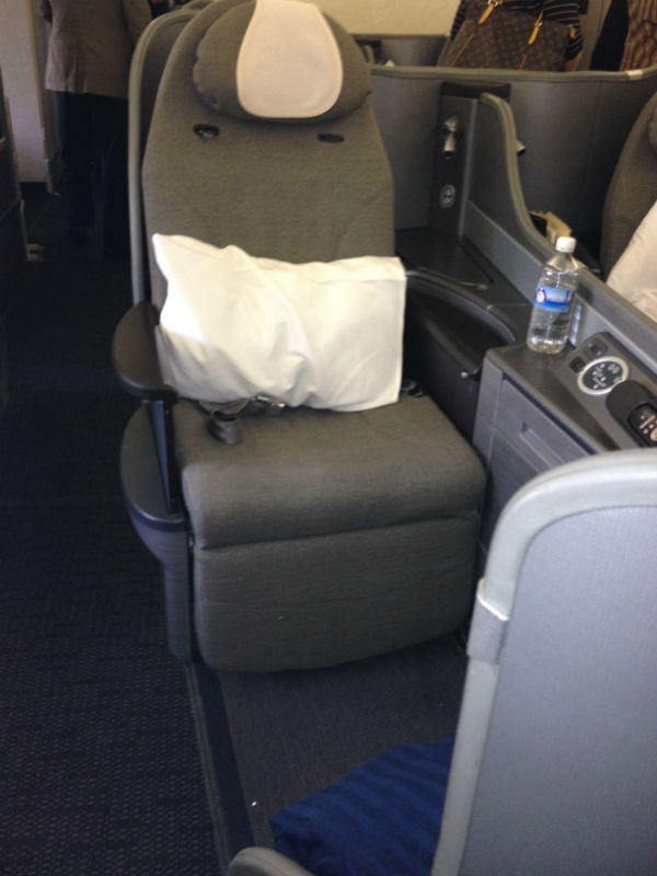 United Global First aisle seat - a bit less storage space than the window seats