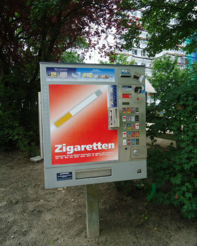 Cigarette vending machine by the neighborhood playground