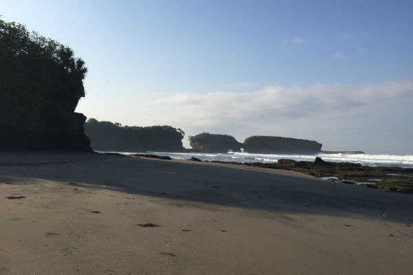 The black sand beach in front of Villa Bulung Daya