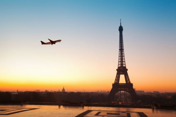 Airplane Flying Over Eiffel Tower Paris