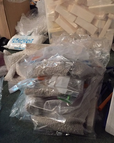 Hygiene kits for Calais Jungle refugees, containing soap, toothbrush, toothpaste, and a towel