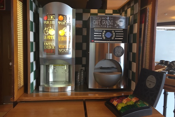 Coffee and juice dispenser at the breakfast buffet Hotel Ibis Calais