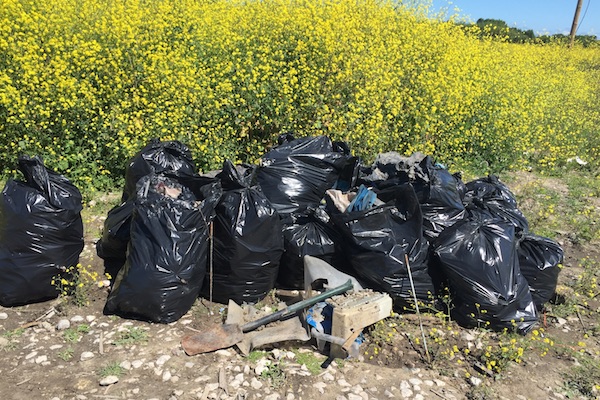 Full trash bags at the Calais Jungle refugee camp